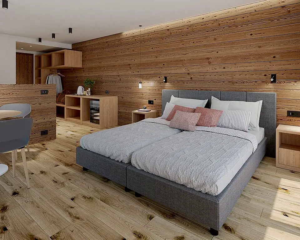 Camera da letto con boiserie in legno naturale e letto imbottito grigio